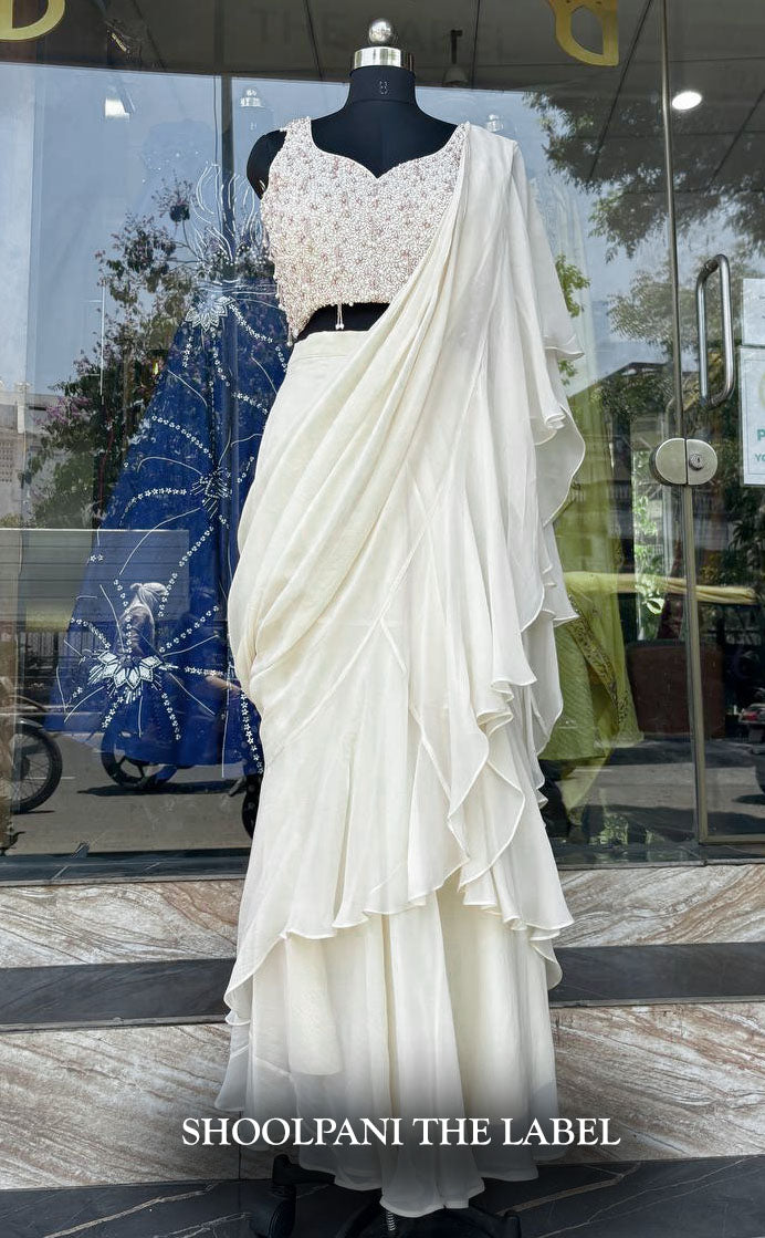 Elegance in Off-White: Viscose Organza Ruffle Saree with Heavy Pearl Hand Work Blouse