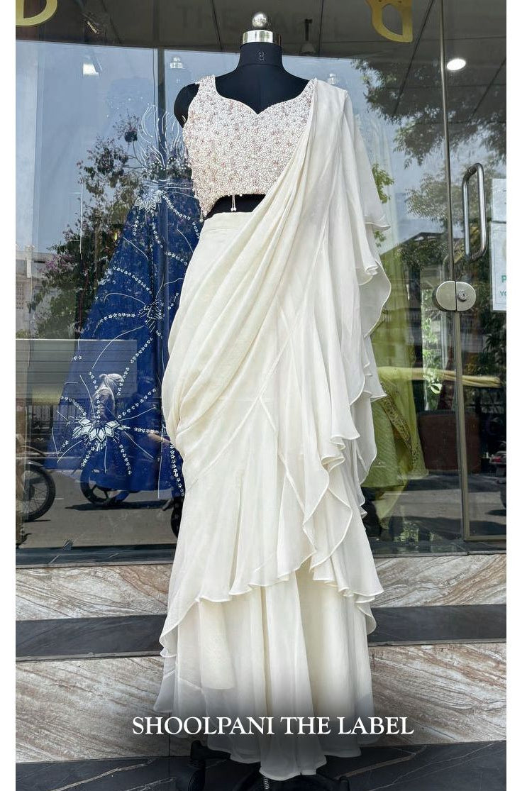 Elegance in Off-White: Viscose Organza Ruffle Saree with Heavy Pearl Hand Work Blouse