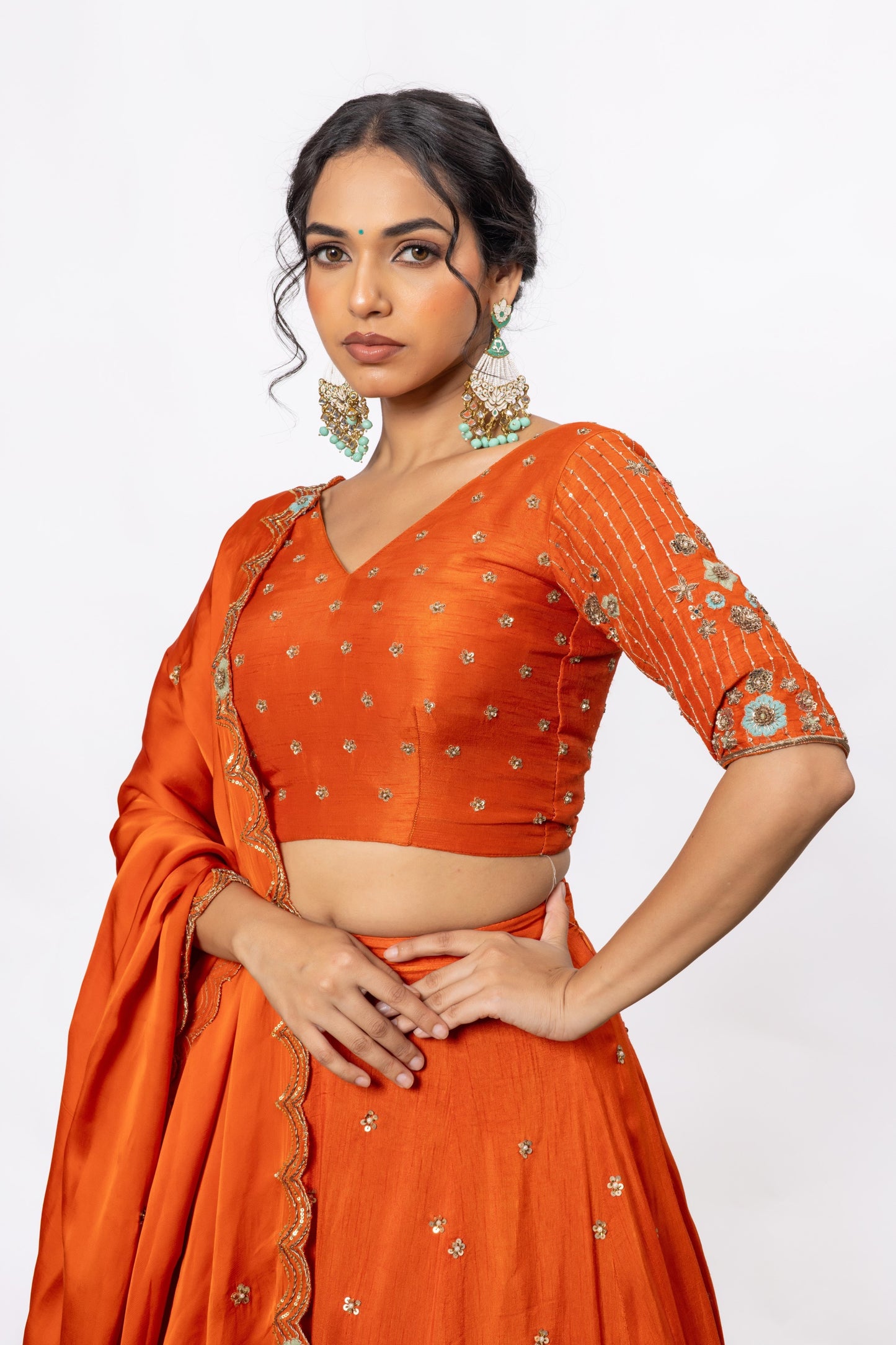Sitarah Rust Orange Silk Kalidar Lehenga Set — Hand Aari Work with Turquoise Thread Flowers