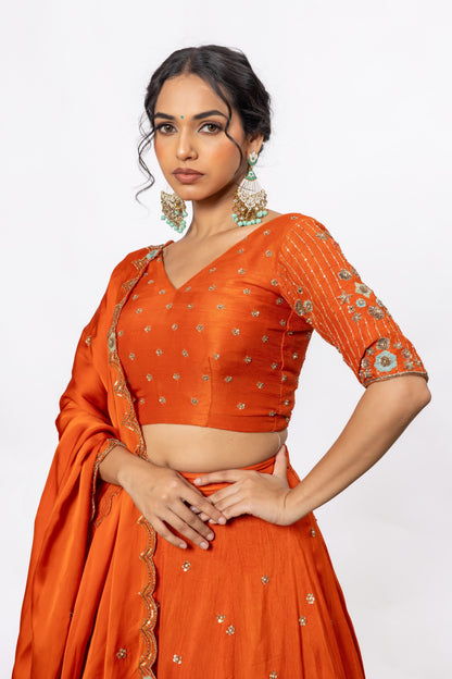 Sitarah Rust Orange Silk Kalidar Lehenga Set — Hand Aari Work with Turquoise Thread Flowers